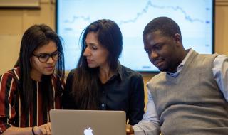 Three students trading