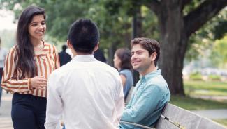 students talking outside